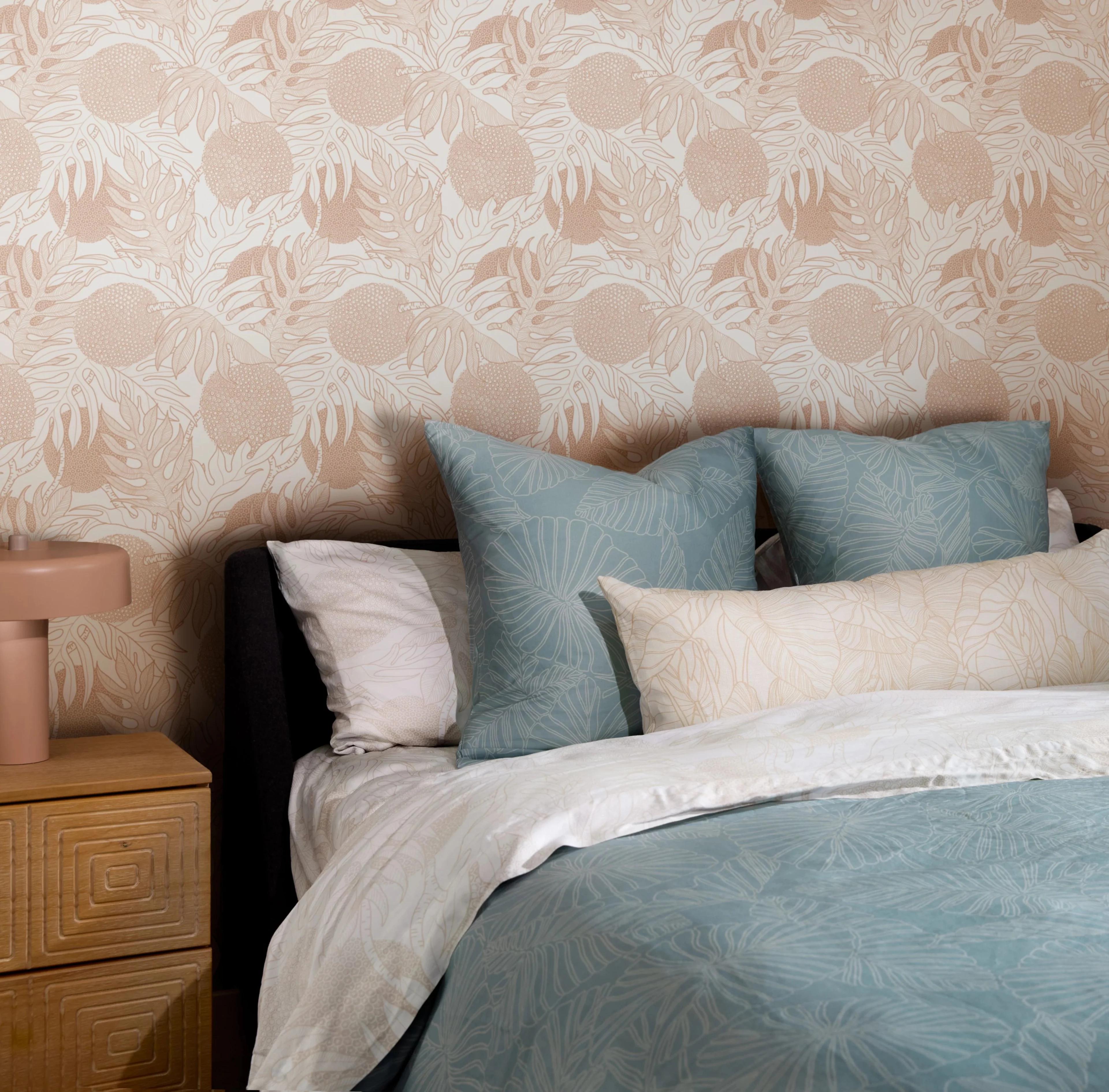 Bed with a neutral duvet cover and pillows.