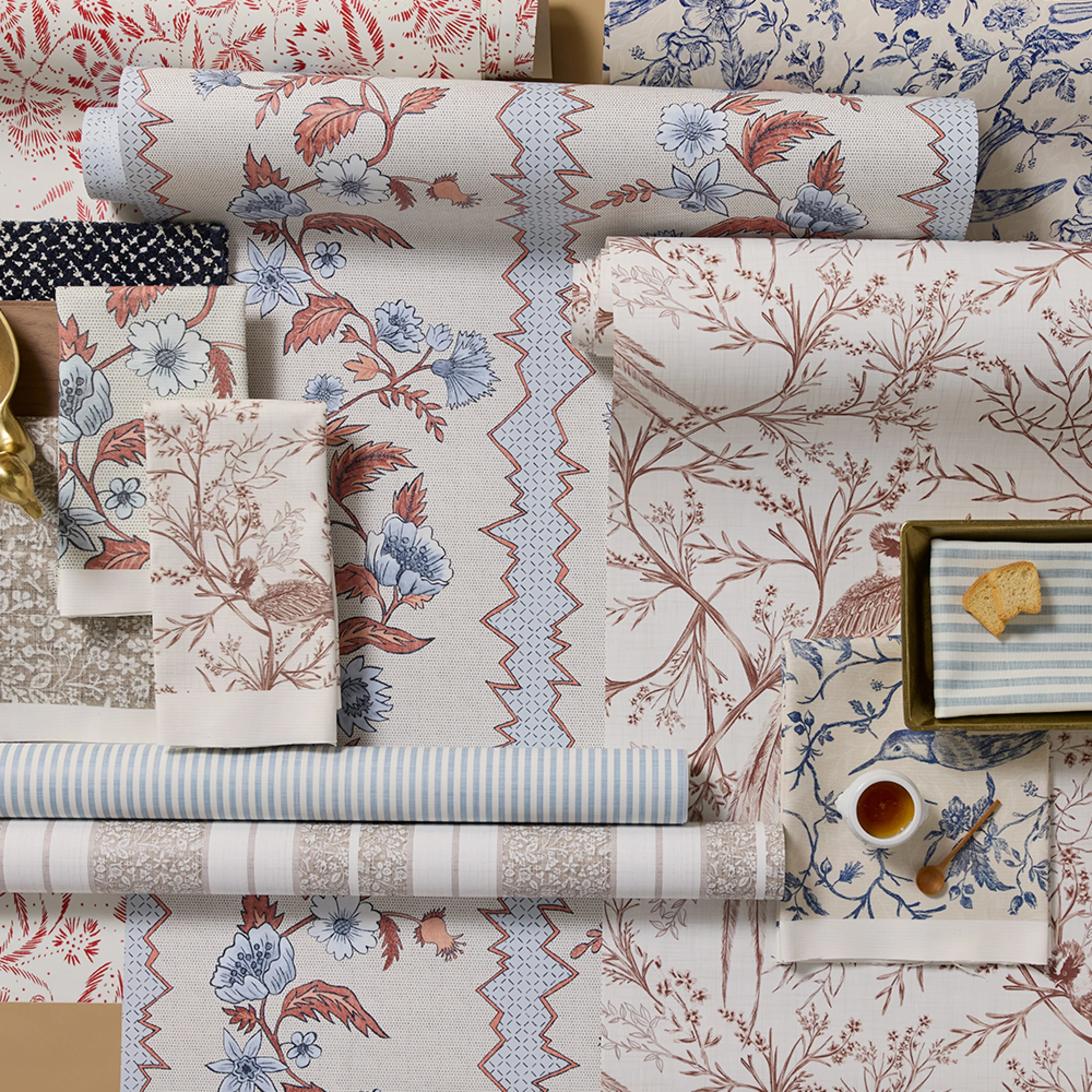 Rolls of French country style wallpaper.