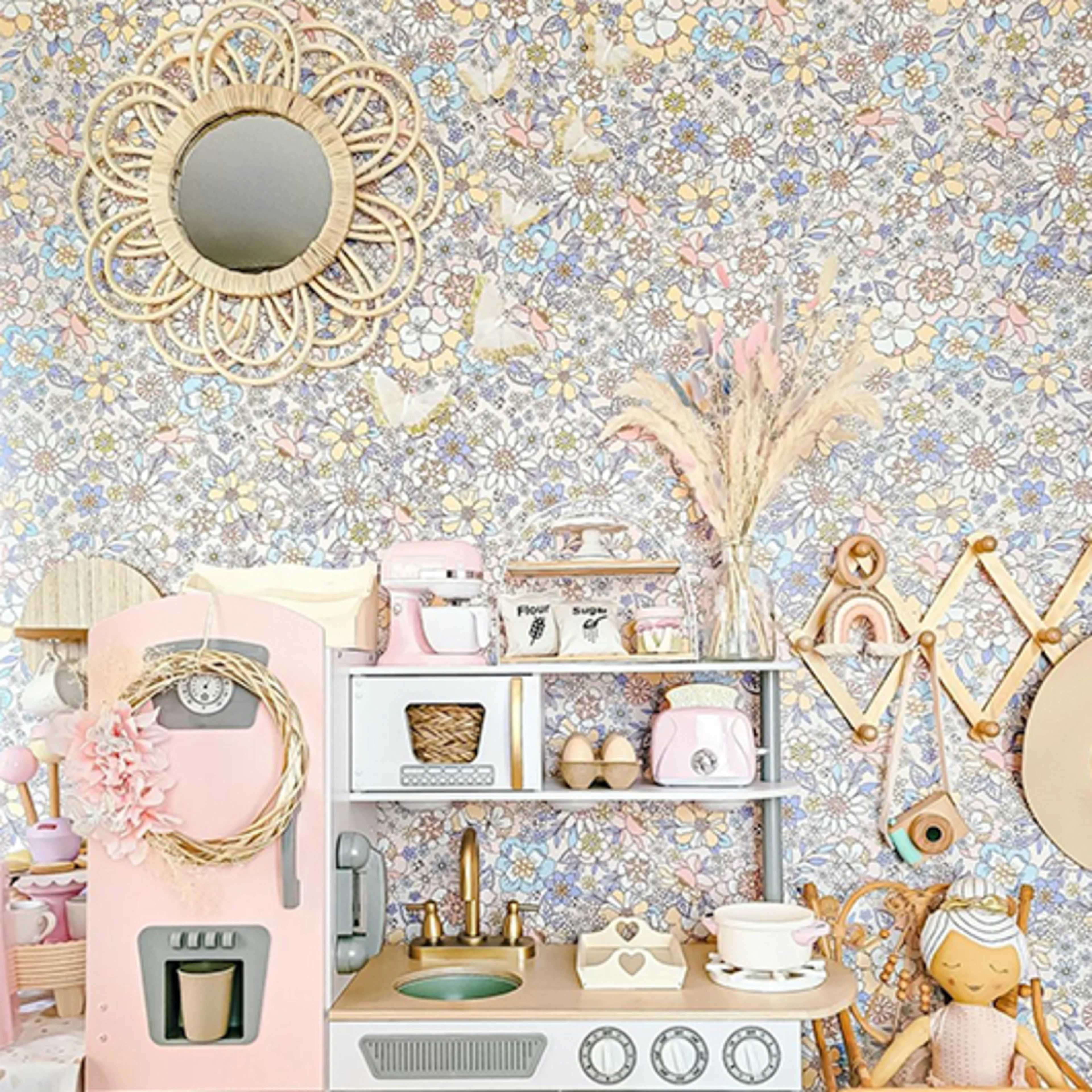 Floral Wallpaper behind a kids play kitchen.