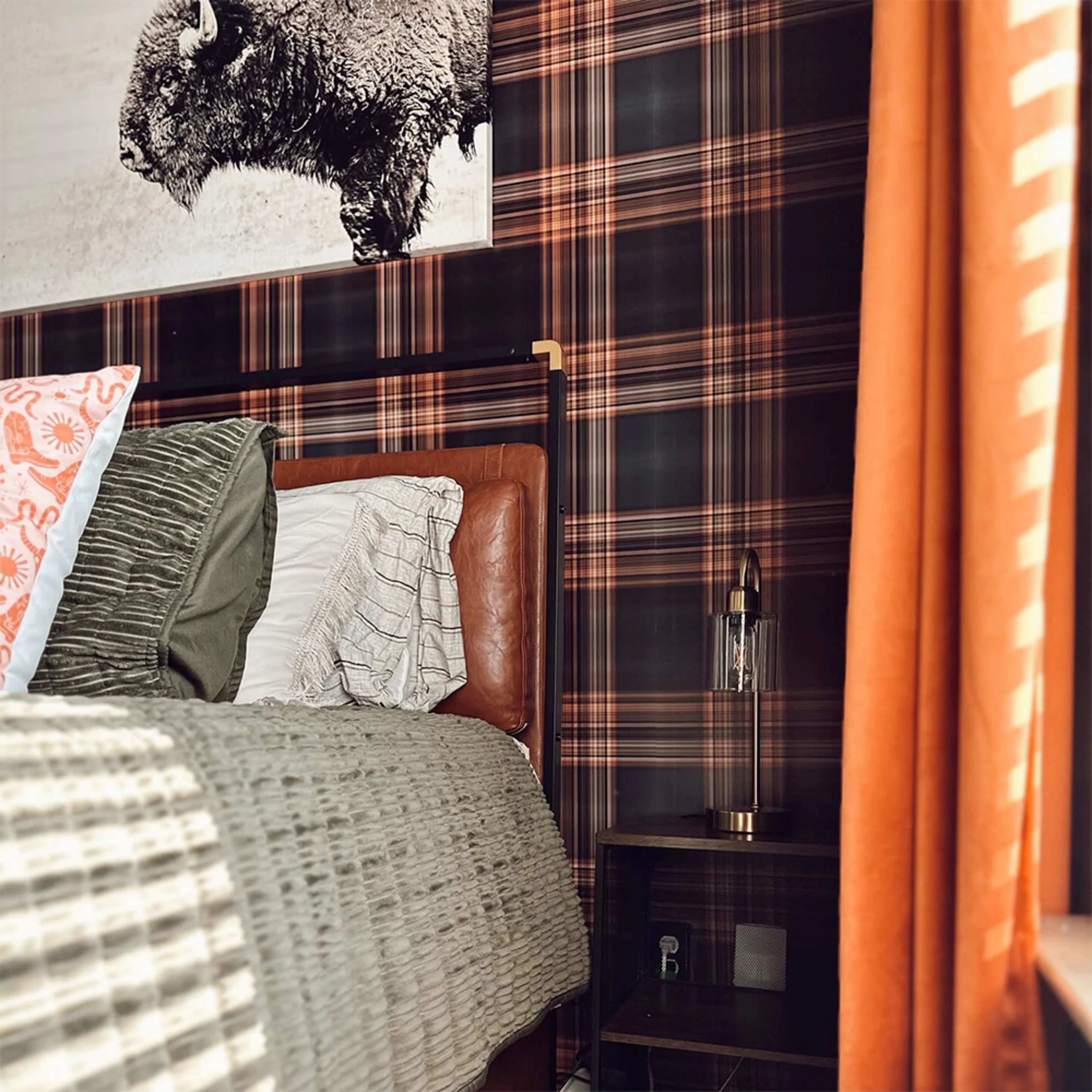 Bedroom with dark plaid wallpaper