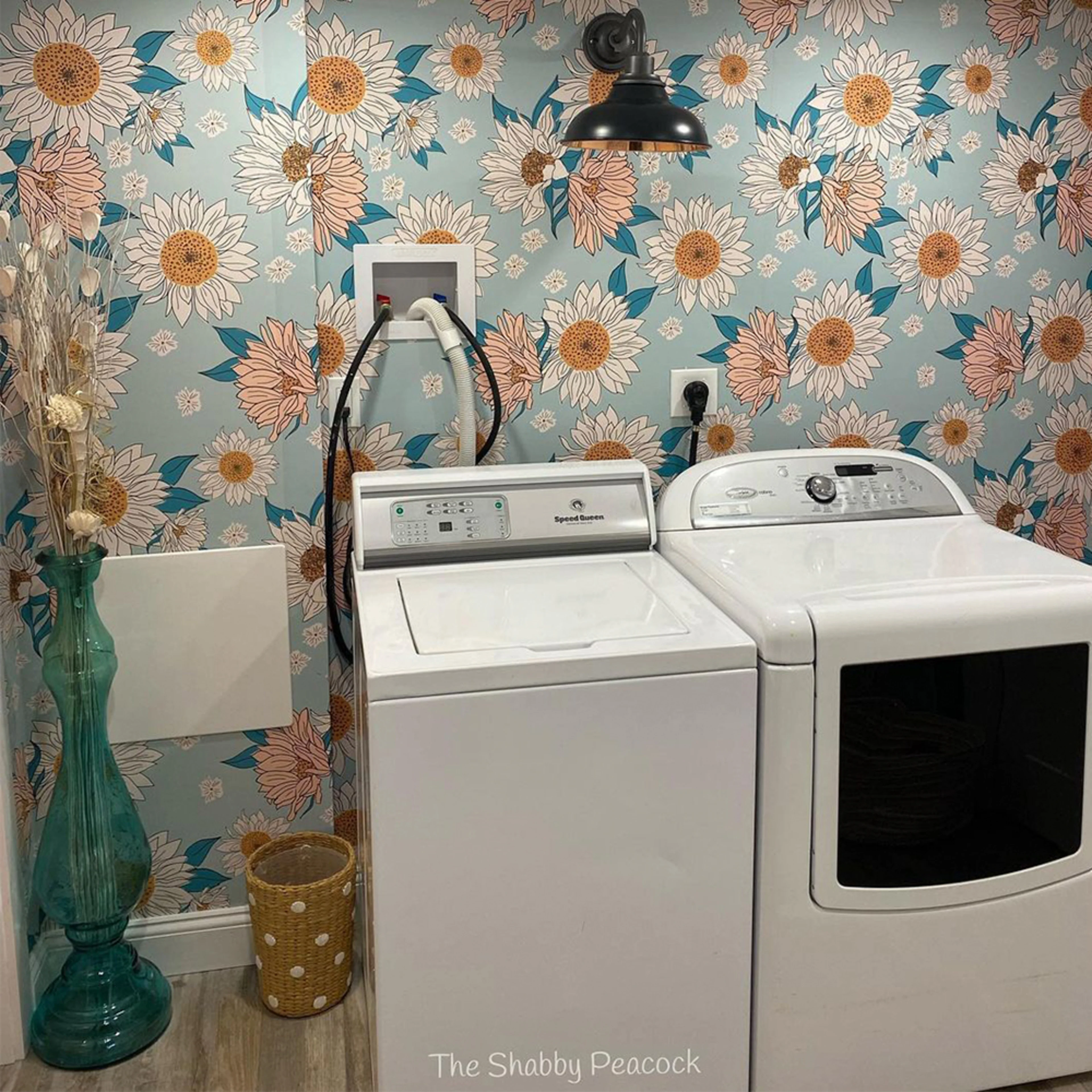 Laundry room with blue floral wallpaper